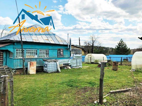 Бревенчатый дом с коммуникациями в деревне Редькино на 13 сотках